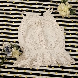 Sleeveless white lace blouse